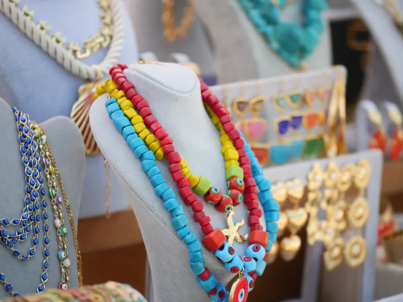 Funda Sourcing jewelry add-ons product sourcing image with necklaces, bracelets, earrings, and accessory sets with custom packaging