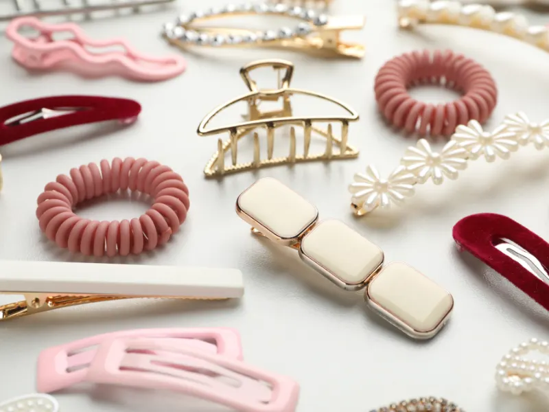 Funda Sourcing hair accessories product sourcing image with clips, bands, pins, headbands, and giftable accessory sets